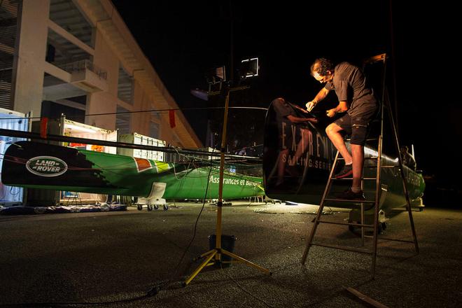 The Extreme Sailing Series 2014. Act 1. Singapore. Day 3.  Groupama Team France skippered by Franck Cammas (FRA) make repairs and re-rig their yacht overnight <br />
 © Lloyd Images